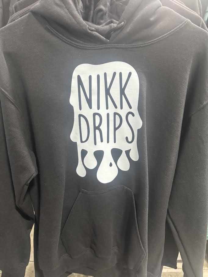 Nikk Drips Hoodie with Vinyl Logo displayed on a black cotton hoodie with a stylish front pocket.