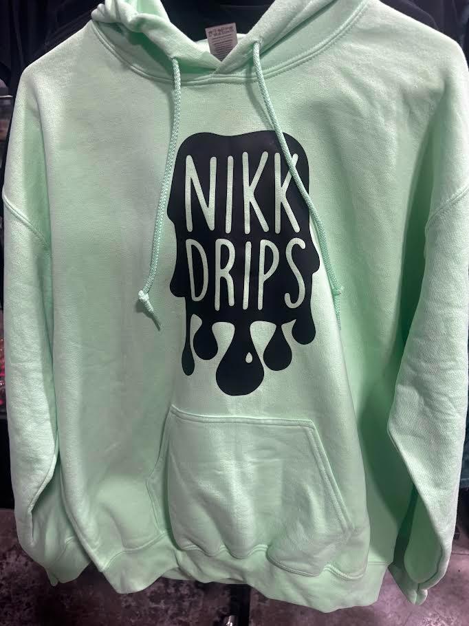 Nikk Drips Hoodie with Vinyl Logo displayed in mint green color, showcasing a bold graphic on the front.