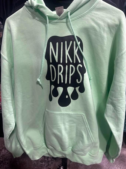 Nikk Drips Hoodie with Vinyl Logo displayed in mint green color, showcasing a bold graphic on the front.