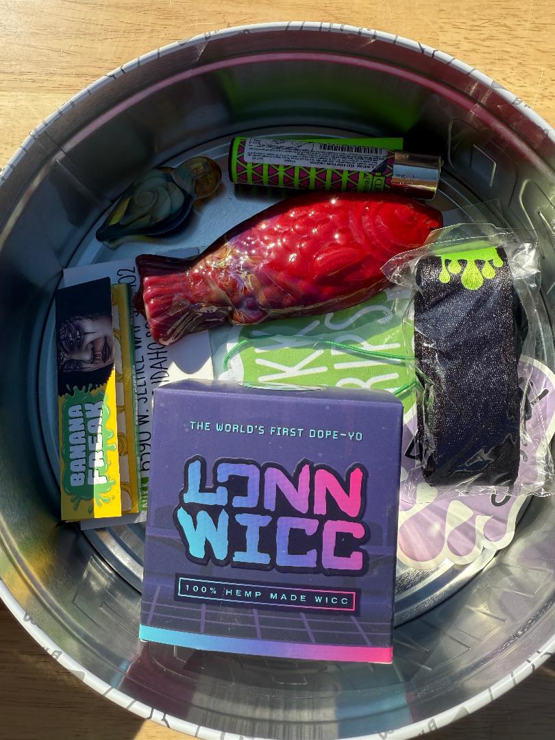 Nikk Drips Mystery Box Tins - Flower Based with assorted smoke shop essentials in collectible tin.