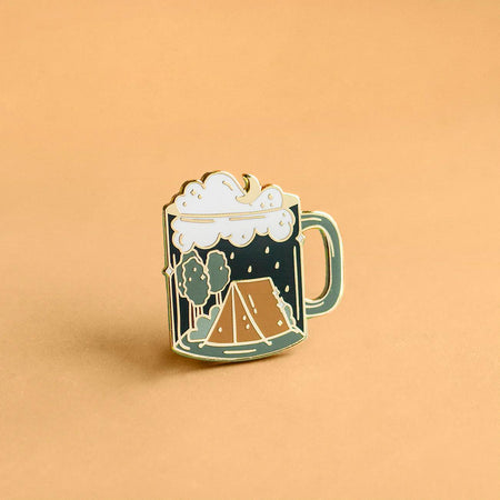Occasionalish Enamel Pin - Camping Mug featuring a camping scene with a tent and trees in a mug design.