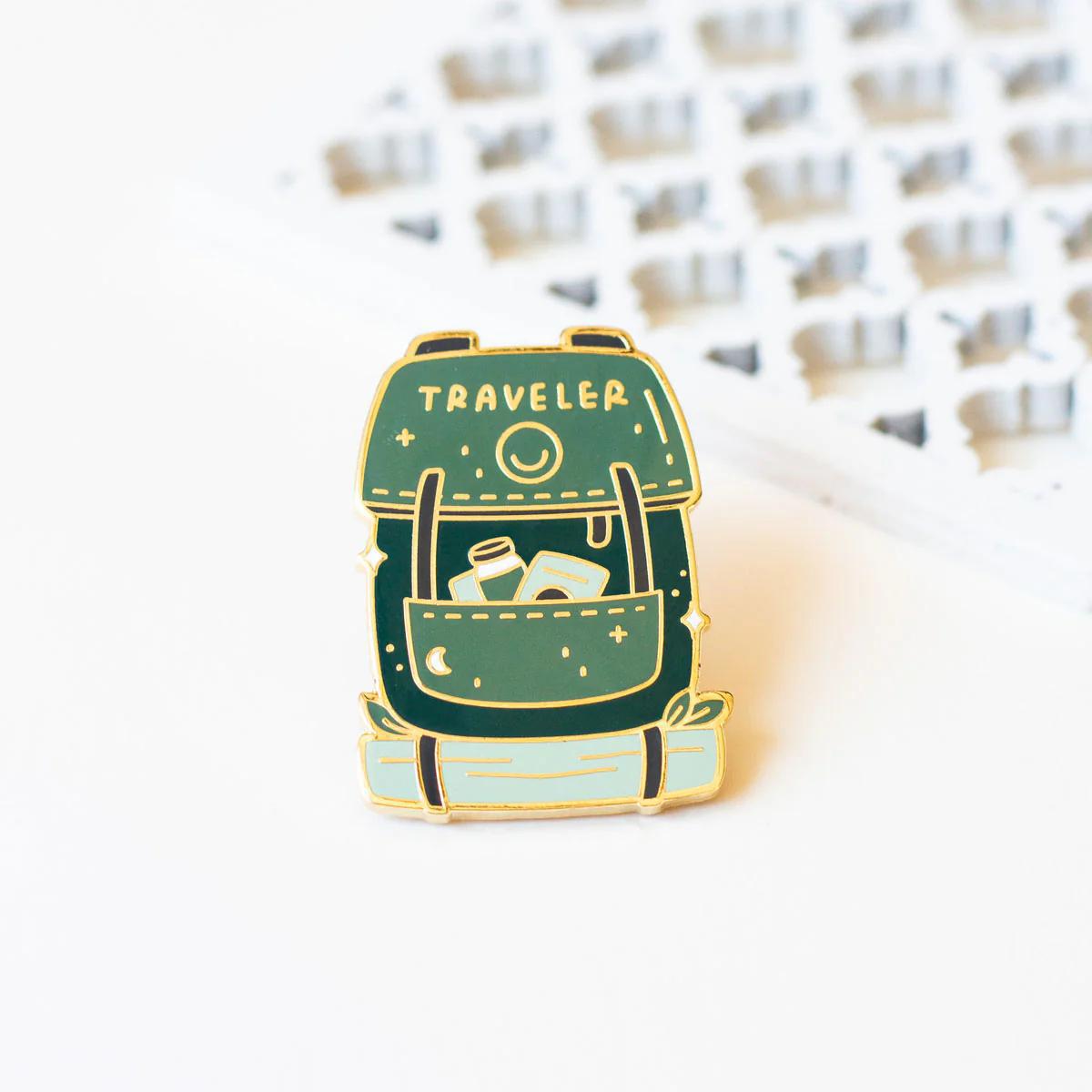 Occasionalish Enamel Pin - Travelers Backpack designed for adventurers and wanderers, featuring a detailed traveler backpack design.
