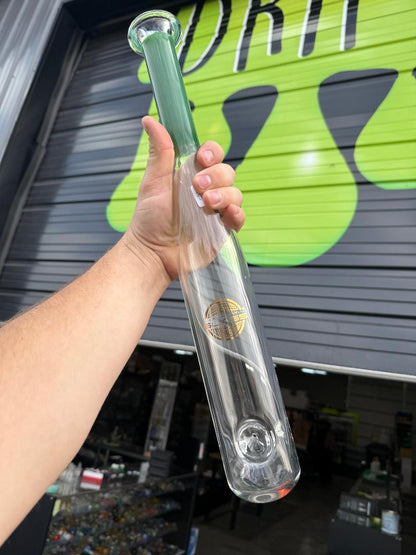 On Point Glass Baseball Bat  - Green held by a person in a store, showcasing its clear design and green accent.