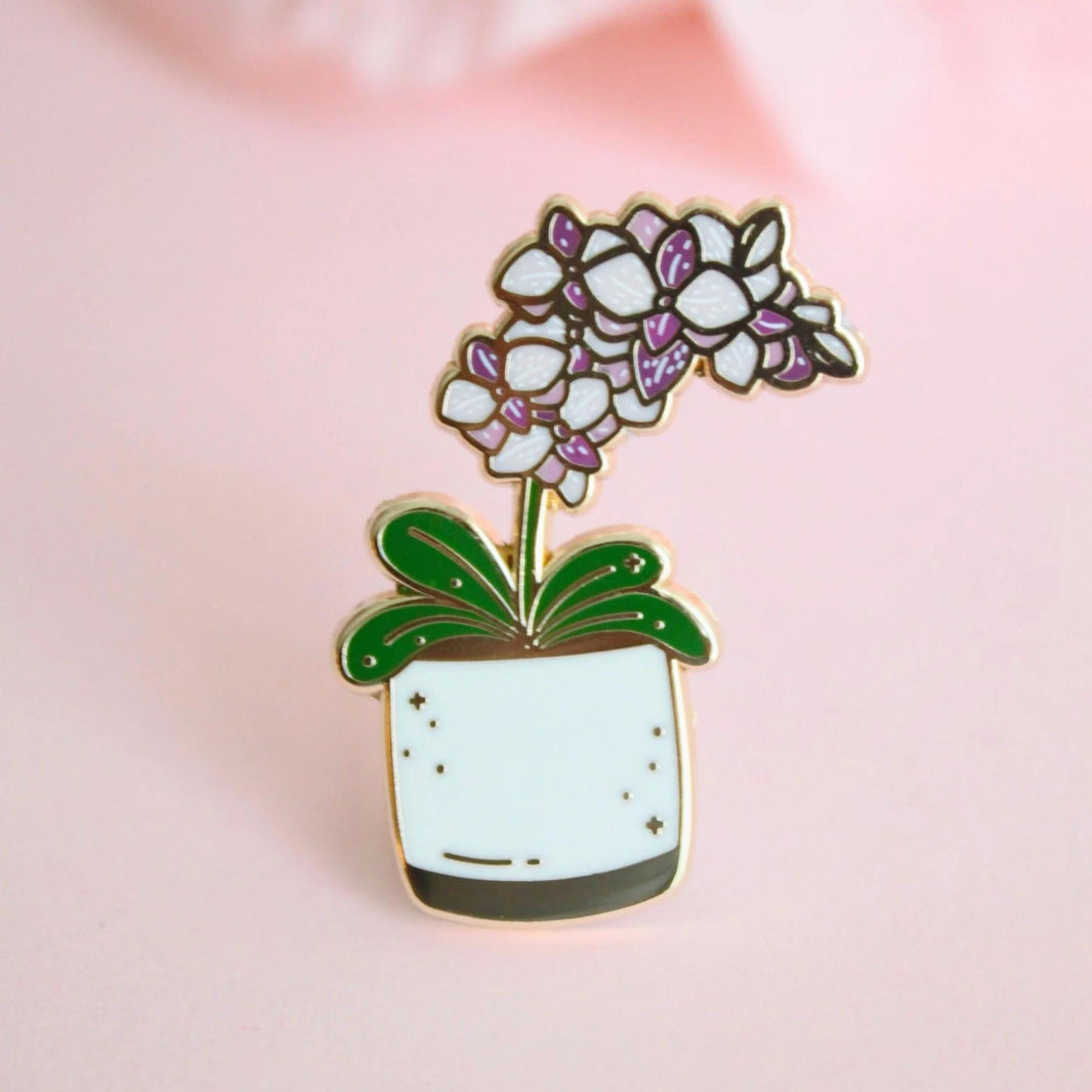 Occasionalish Enamel Pin - Pot Of Orchids featuring a colorful orchid in a decorative pot.