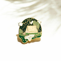 Occasionalish Enamel Pin - Campsite featuring a tent and greenery with the text 'OUTSIDE'.