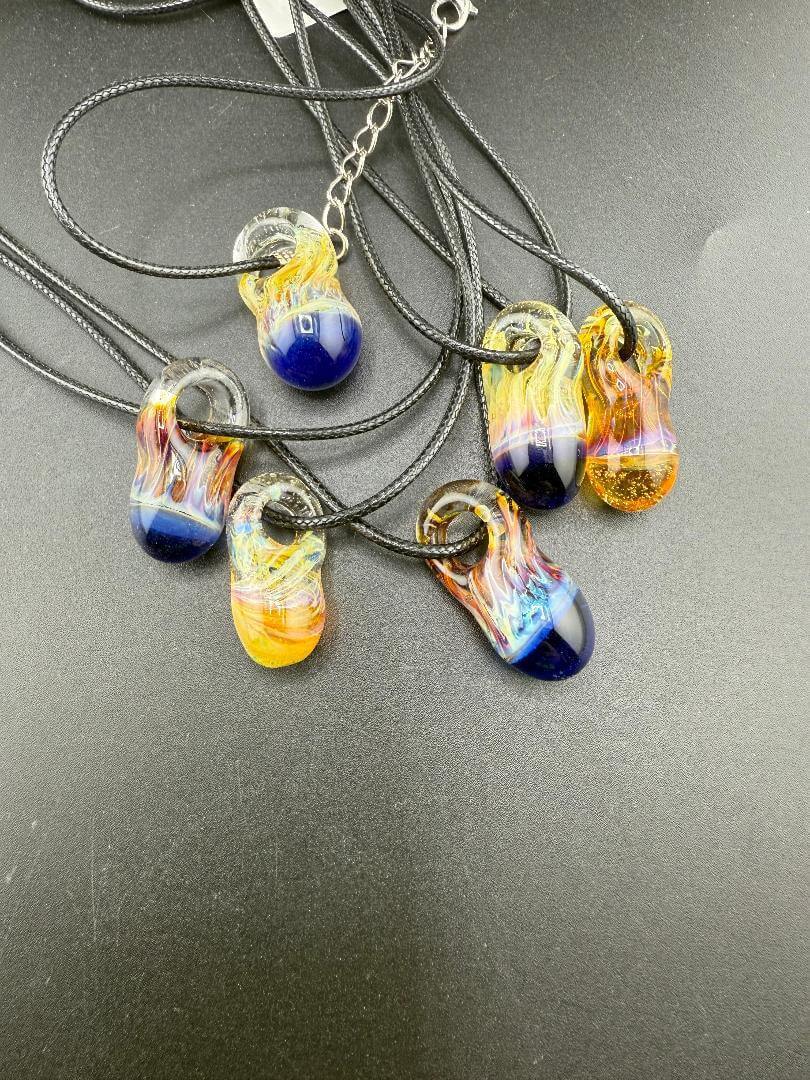 Pablos Glass Giblets Neckless Pendant – Tiny Fumed Chaos Design in vibrant colors on black cords.