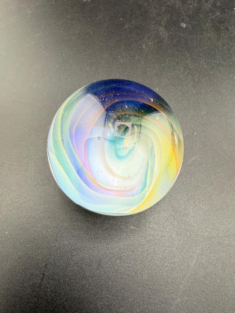 Mop Head Glass Marble - Pastel Vortex 1.2" - 1.5" showcasing a colorful swirl design on a dark surface.