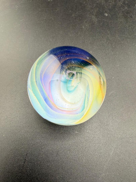 Mop Head Glass Marble - Pastel Vortex 1.2" - 1.5" showcasing a colorful swirl design on a dark surface.