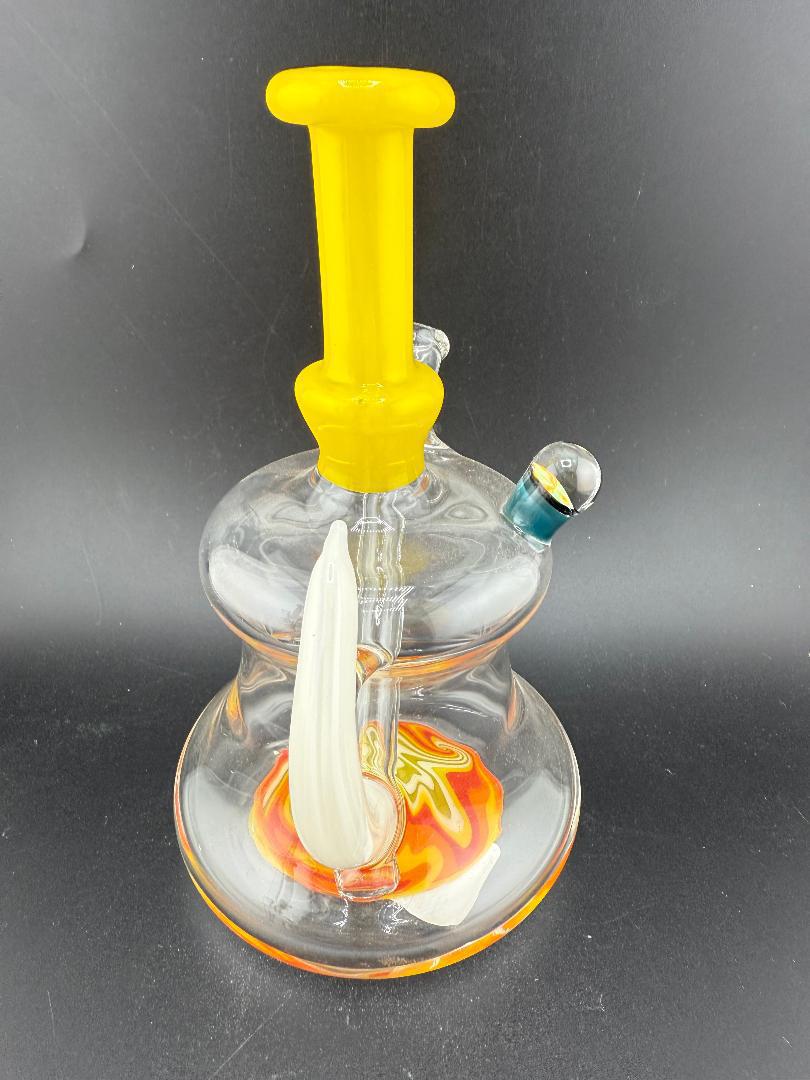 Paul Smith Glass Horned Wig Wag Rig 10mm 45° in yellow and orange with vibrant wig wag design at Nikk Drips.