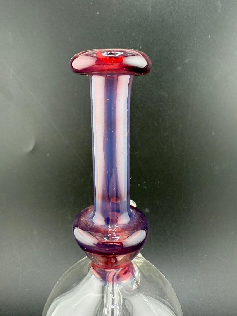 Paul Smith Glass Purple Rig – 10mm 45° Joint, hand-blown glass top view showcasing elegant purple design.