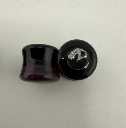 Paulson Pieces 10mm ear plugs made of handcrafted borosilicate glass, showcasing unique colors and artistic design.