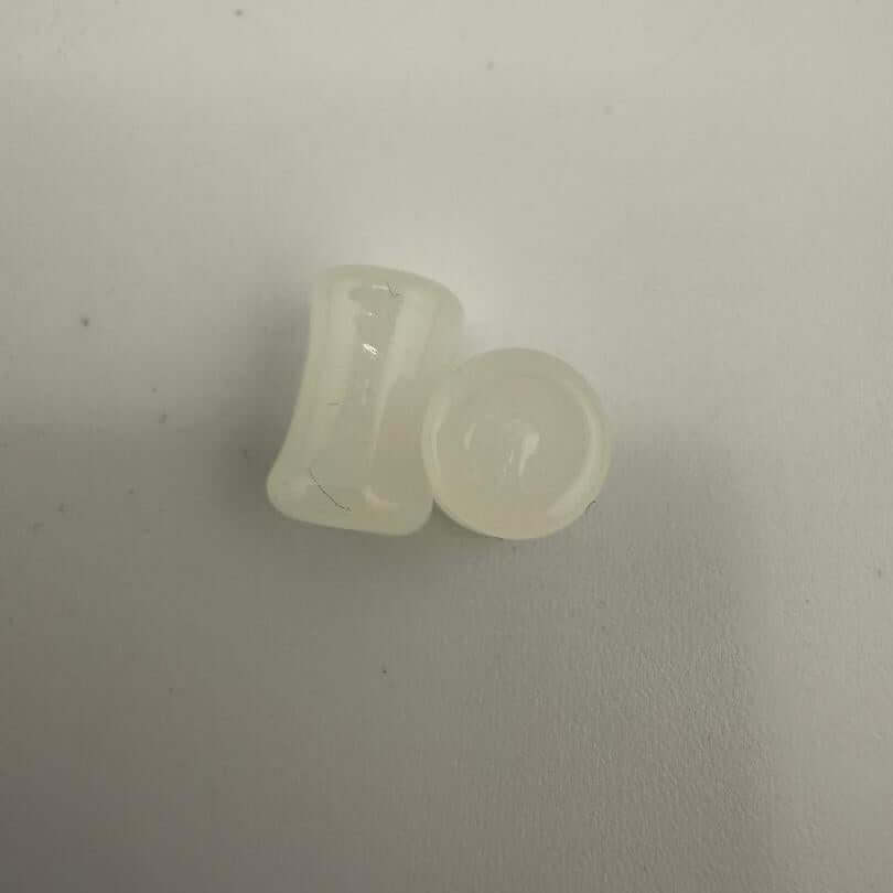 Paulson Pieces 6.5mm ear plugs in white, handcrafted borosilicate glass, showcasing minimalist design and premium quality.