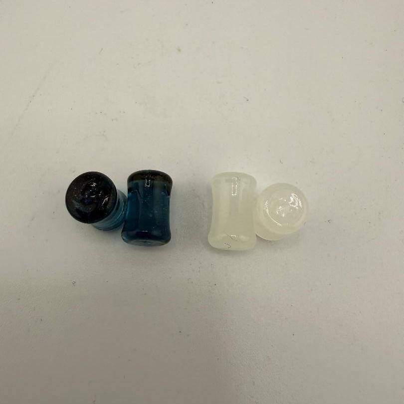 Paulson Pieces handcrafted 6.5mm ear plugs in blue and white borosilicate glass, showcasing minimalist design.