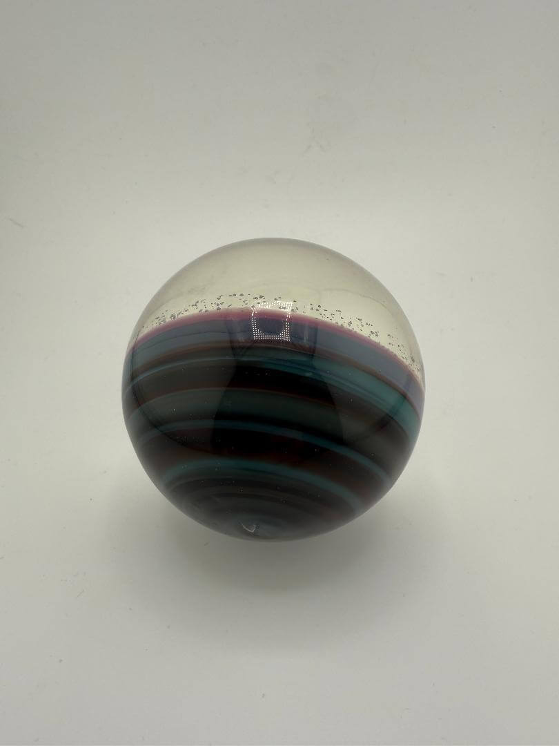 Paulson Pieces extra large marble with unique black, teal, and purple stripes, perfect for collectors and decor.