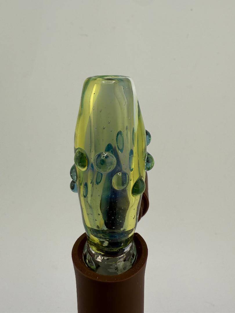 Paulson Pieces Green Puffco Pivot Topper with colorful design, enhancing Puffco Peak Pro experience.