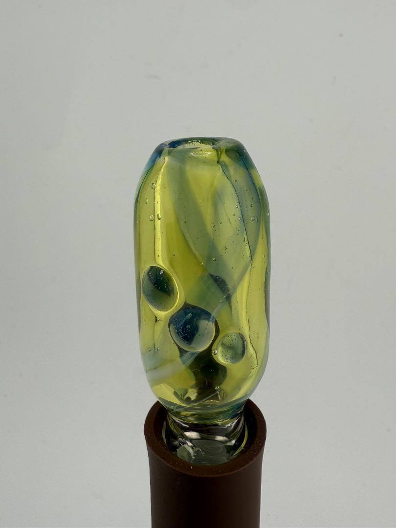 Handcrafted green and blue glass topper for Puffco, featuring unique design and texture for enhanced dabbing experience.