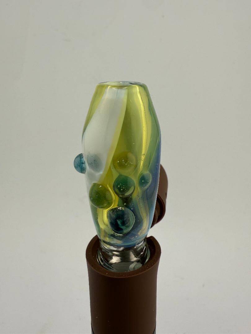 Paulson Pieces Green Puffco Pivot Topper with colorful glass design, enhancing airflow and heat retention for dabbing.