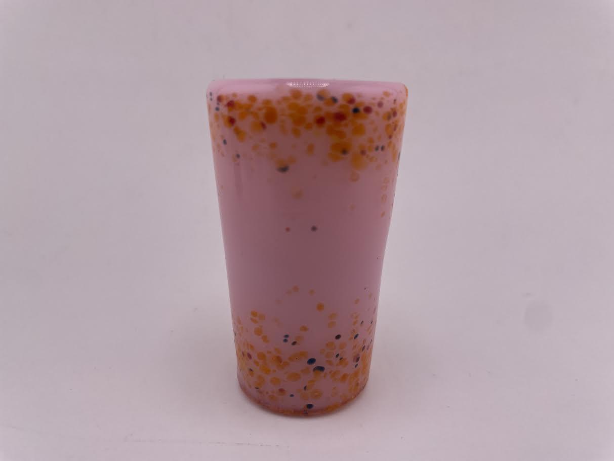 Paulson Pieces Shot Glass in pink with orange speckles, crafted from durable borosilicate glass.