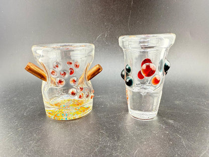 Paulson Pieces Shot Glass showcasing handcrafted designs with real bullet and artistic dot styles.