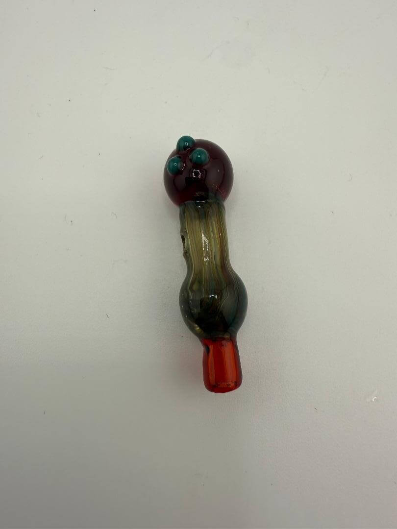 Handcrafted glass pipe in unique colors with decorative marbles, ideal for enhancing smoking sessions.
