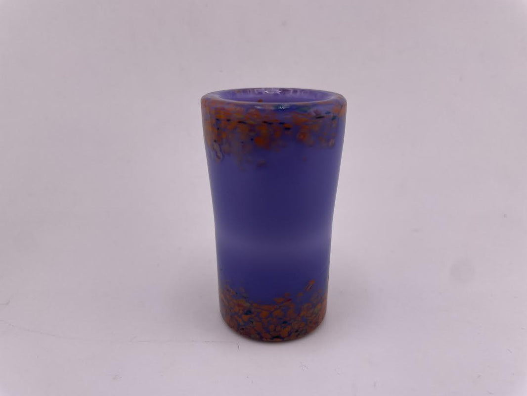 Paulson Pieces Shot Glass in vibrant purple with orange specks, handcrafted from durable borosilicate glass.