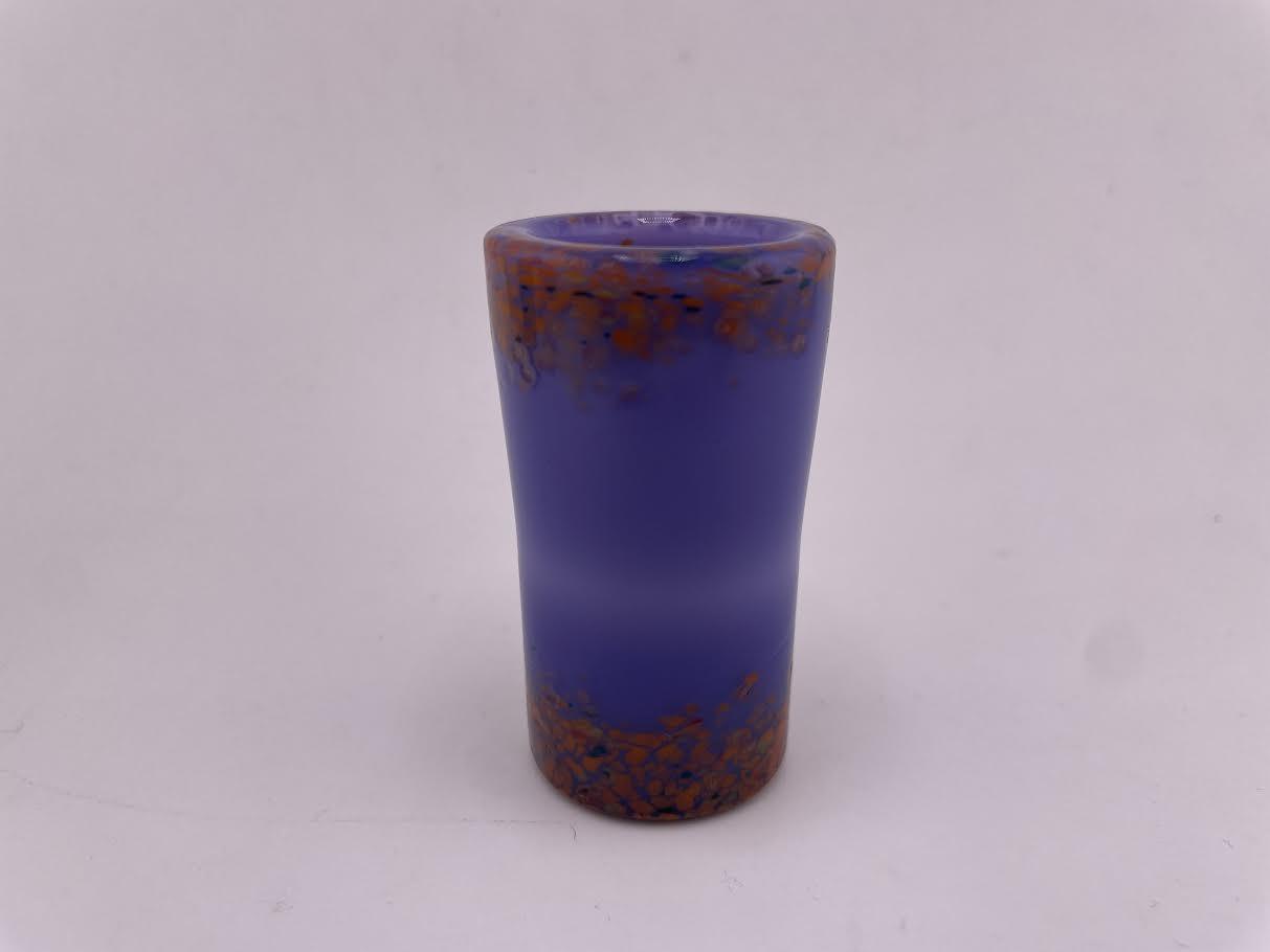 Paulson Pieces Shot Glass in vibrant purple with orange specks, handcrafted from durable borosilicate glass.