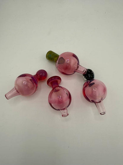 Four Paulson Pieces Telemagenta 24mm bubble caps in varying pink shades, perfect for enhancing smoking experience.