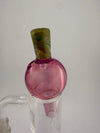 Telemagenta 24mm bubble cap by Paulson Pieces, featuring a pink and green swirled design, ideal for enhancing your smoking experience.