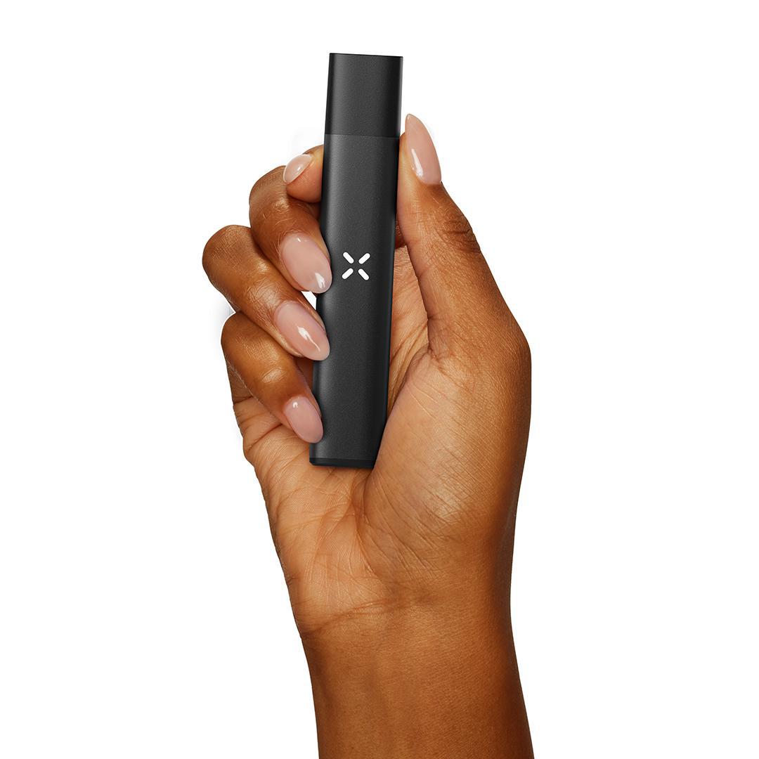 Hand holding the Pax Era Go, a compact device designed for easy and flavorful draws.