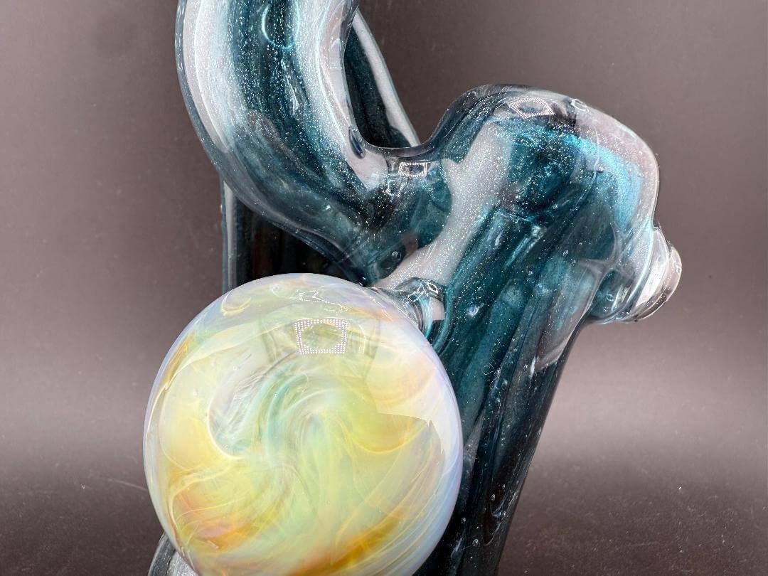 Phranq Glass Bubbler - Blue Stardust w/ Fumed Chaos Pendant & Large Leaf showcasing artful craftsmanship and brilliant colors.