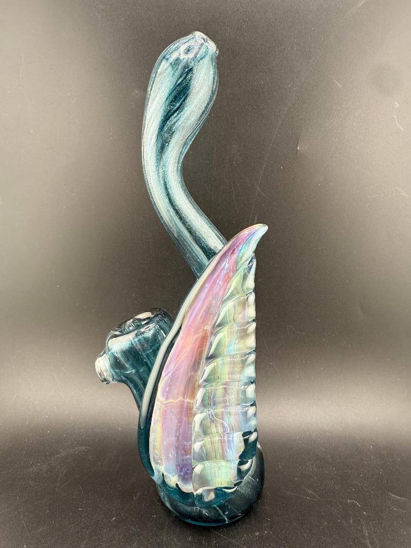 Phranq Glass Bubbler - Blue Stardust w/ Fumed Chaos Pendant & Large Leaf showcasing its shimmering design.
