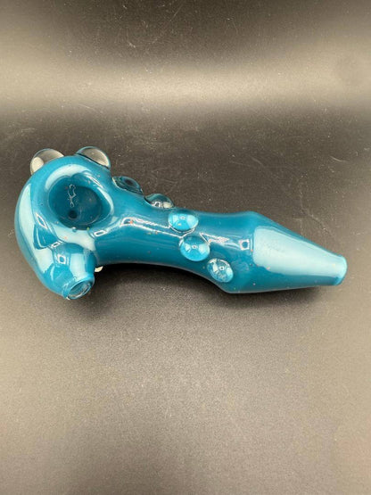 Phranq Glass Hand Pipe - Teal & Crushed Opal with a vibrant teal body and unique bubble accents on a black background.