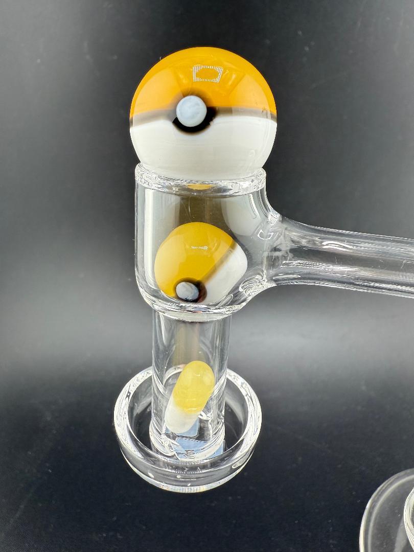 Close-up of Pokeball Terp Slurper Set showcasing three heady glass pieces for enhanced dabbing experience.