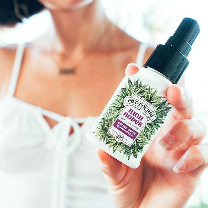 Pot-Pourri Smoke Odor Freshener Spray High Hopes 1.4 Fl Oz - Lemon and Clove held in hand.