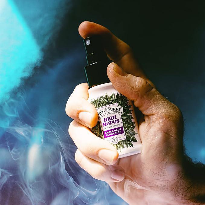 Pot-Pourri Smoke Odor Freshener Spray High Hopes 1.4 Fl Oz - Lemon and Clove in hand with smoke background.