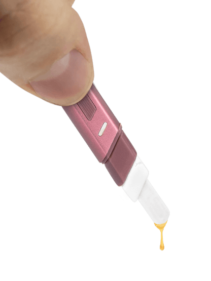 Puffco Hot Knife heated loading tool in hand, dispensing extract, showcasing its USB-C charging and ceramic tip features.