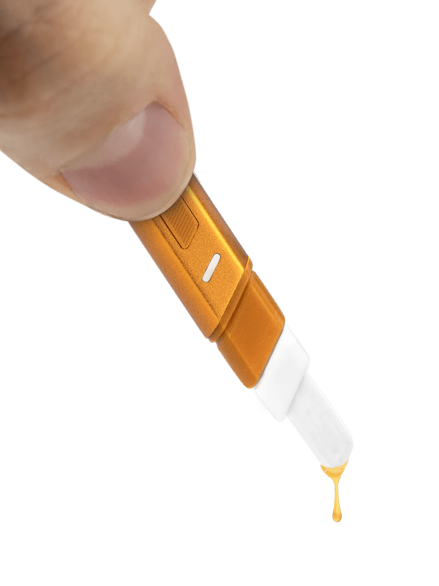 Puffco Hot Knife heated loading tool in hand, dripping extract with a ceramic tip for easy loading.