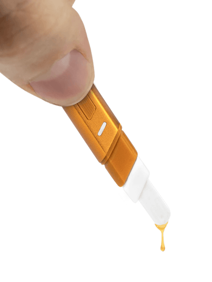 Puffco Hot Knife heated loading tool in hand, dripping extract with a ceramic tip for easy loading.