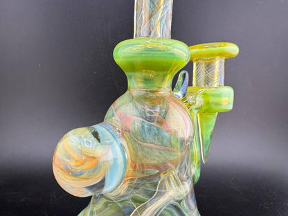 Handcrafted Pugsley Glass Green Worked Rig with vibrant colors and smooth functionality, featuring a 10mm 90° joint.