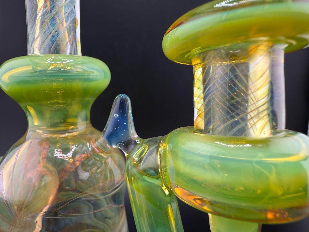 Close-up of Pugsley Glass Green Worked Rig showcasing vibrant green accents and detailed craftsmanship.