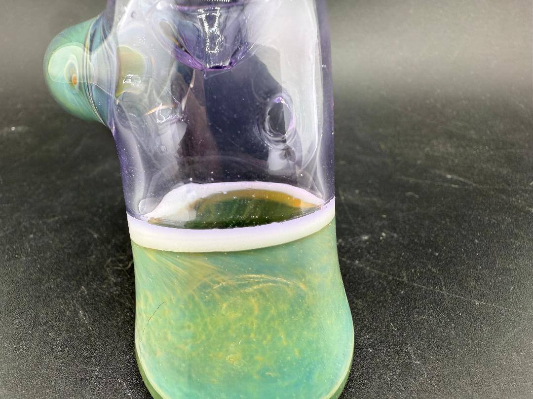 Pugsley Glass Hammer Pipe - Pink & Teal showcasing vibrant colors and a stable base for display and use.