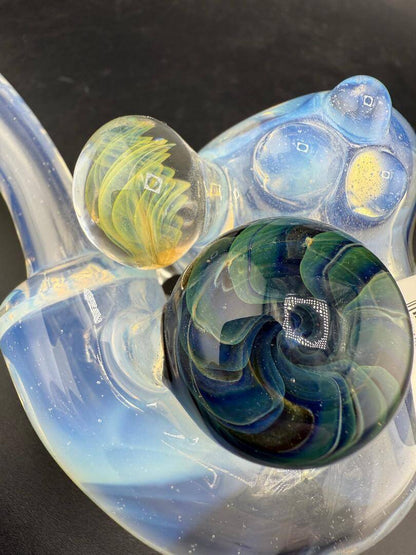 Pugsley Glass Sherlock Pipe - Ghost White w/ Leaf Attachment & Encased Opal showcasing vibrant glass colors and intricate designs.