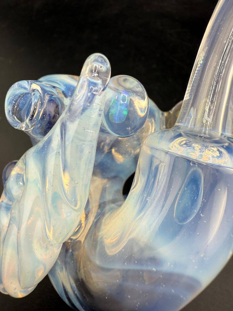 Pugsley Glass Sherlock Pipe - Ghost White w/ Leaf Attachment & Encased Opal showcasing its beautiful clear and blue design.