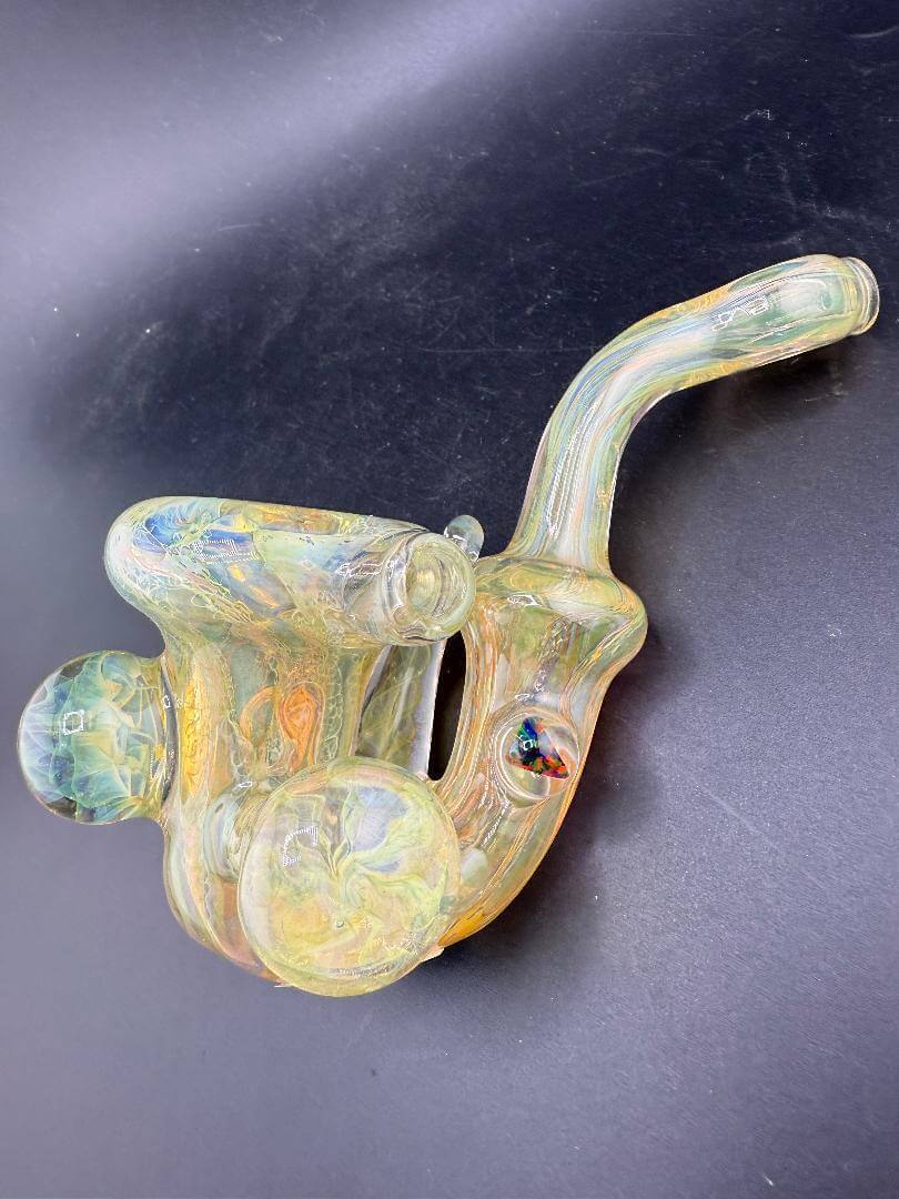 Pugsley Glass Sherlock Pipe - Gold Fumed w/ Fumed Implosion Marbles & Encased Opals featuring colorful design and elegant shape.