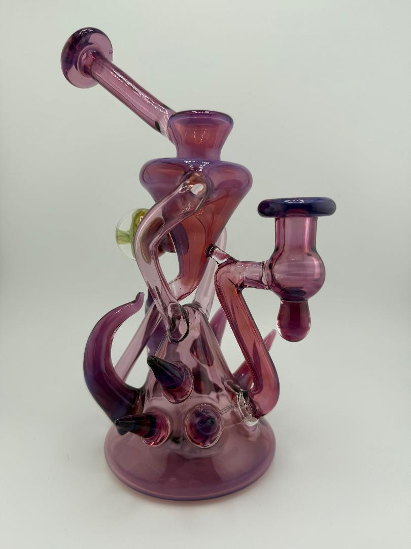 Handcrafted Pugsley Glass Stargazer Spike Recycler in pink, showcasing unique heady glass design for smooth hits.