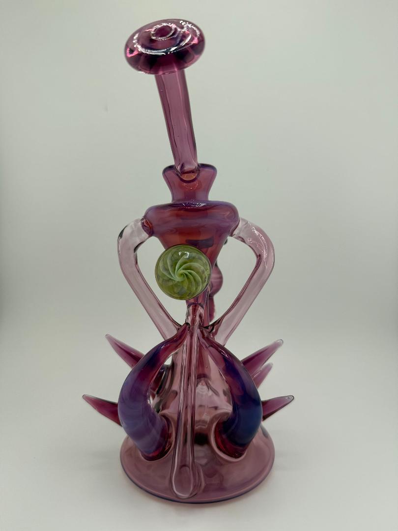 Pugsley Glass Stargazer Spike Recycler 10mm 90° in pink, showcasing heady glass craftsmanship and unique design.