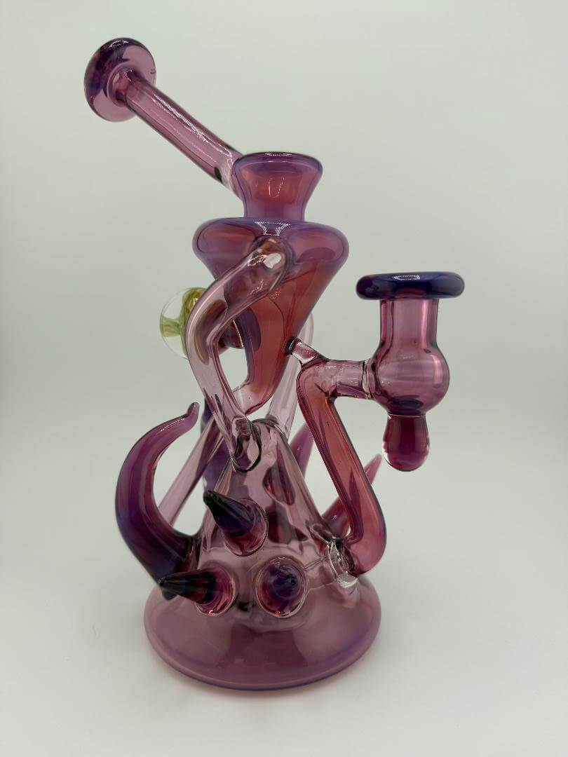 Handcrafted Pugsley Glass Stargazer Spike Recycler in pink, showcasing unique heady glass design for smooth hits.