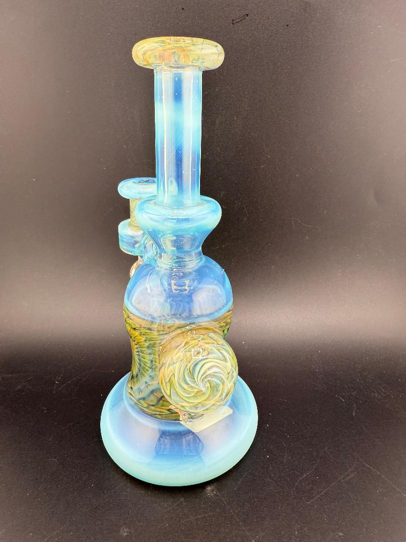 Handmade Pugsley Glass Worked Banger Hanger in blue with intricate accents, 10mm, 90°, showcasing heady glass craftsmanship.