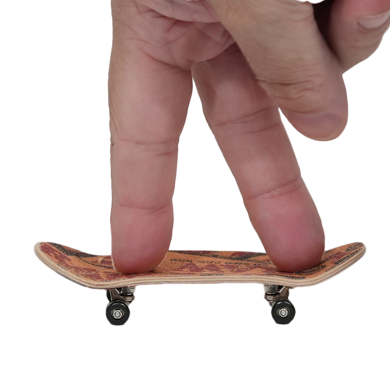 Person using RAW Finger Boards with a kickflip gesture on a mini skateboard.