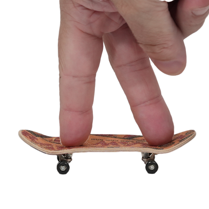 Person using RAW Finger Boards with a kickflip gesture on a mini skateboard.
